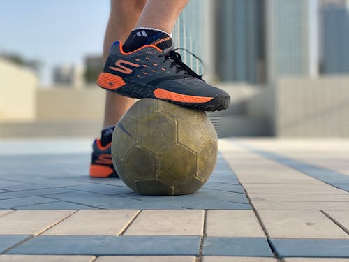 Free Person Stepping on a Soccer Ball Stock Photo