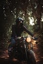 Man in Black Leather Jacket Riding Motorcycle