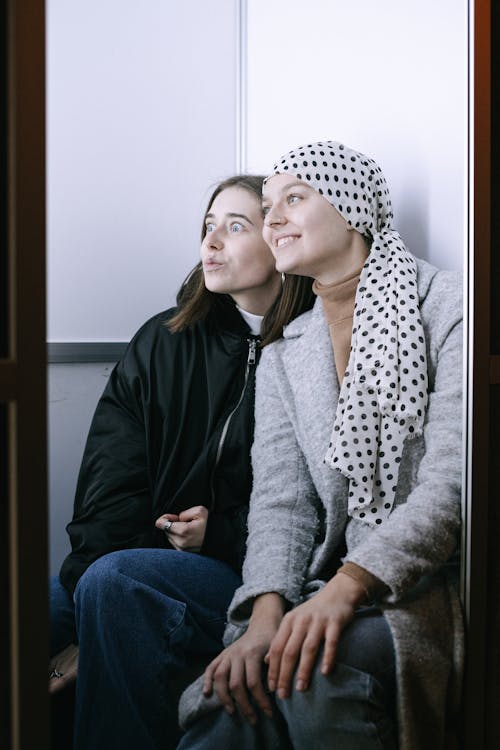 Woman in Black Jacket and White and Black Polka Dot Hijab