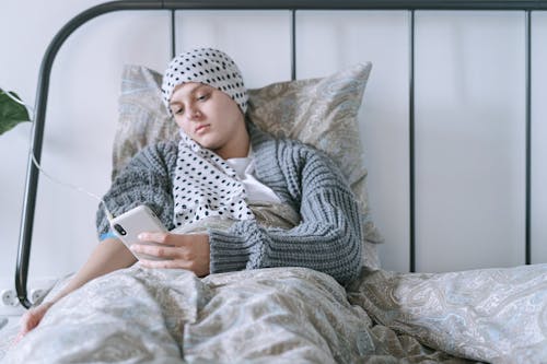 Woman Lying on the Bed with Intravenous Line