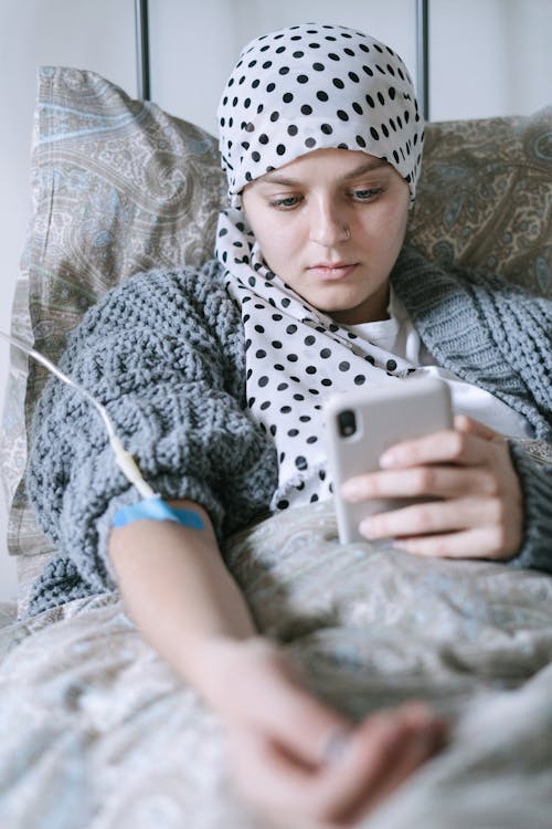 A Patient Using a Phone while Under Treatment