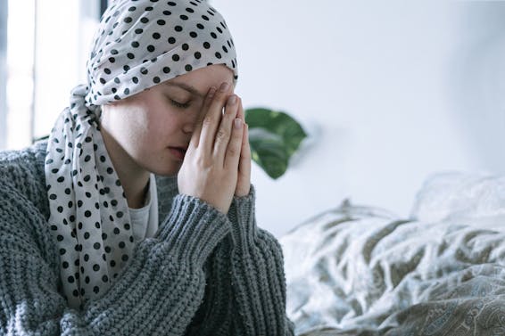 Woman in Gray Knit Sweater Praying