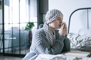 Woman in Gray Knit Sweater Praying