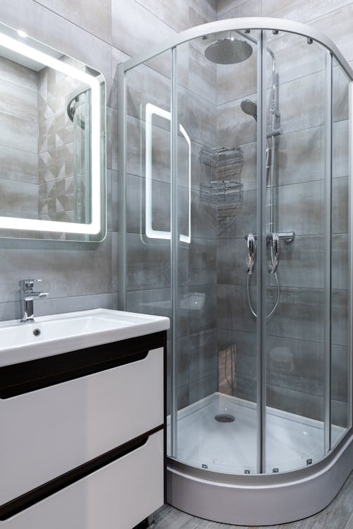 Contemporary shower room interior with washstand in house