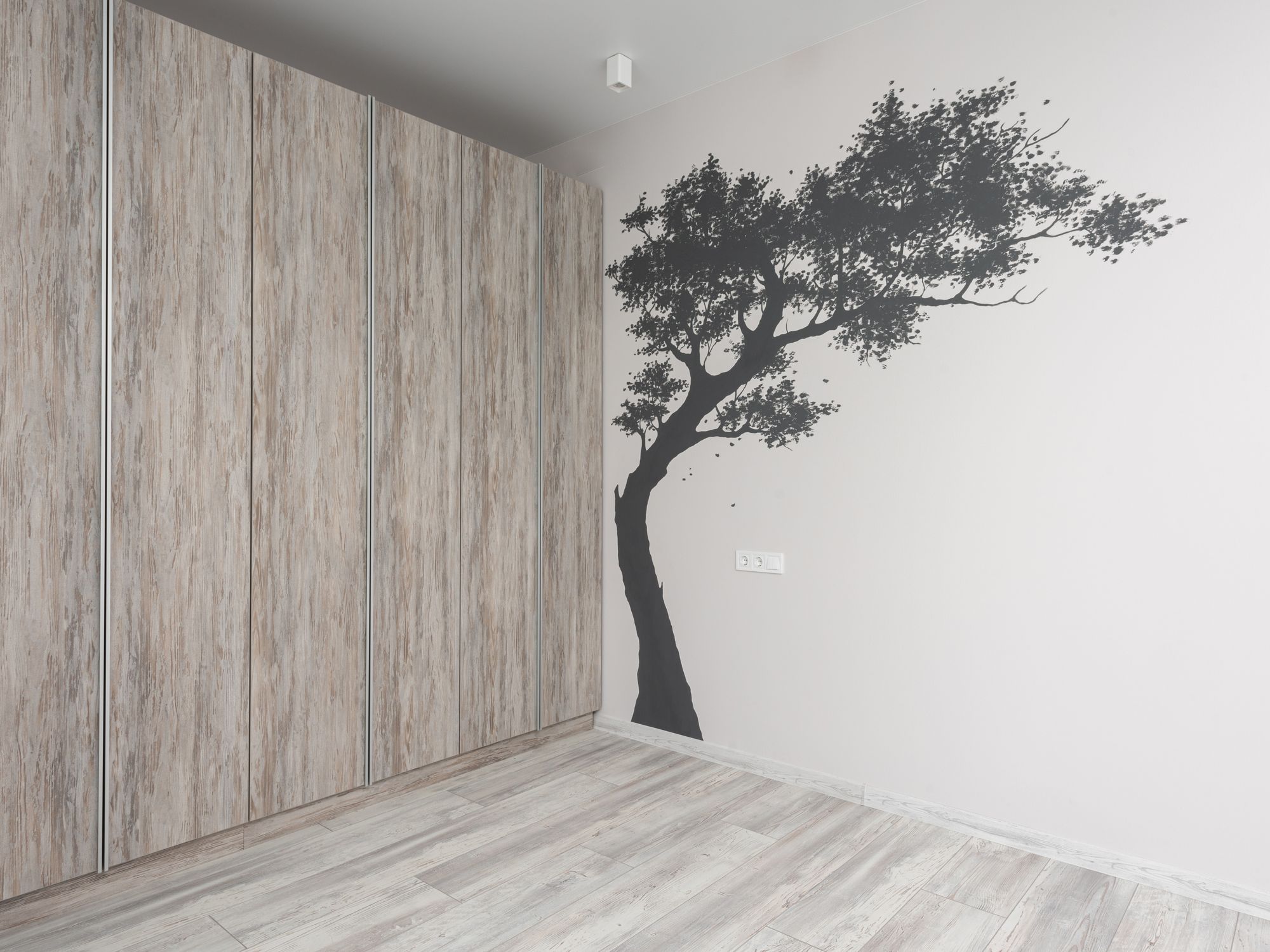 Wallpapering in Bickley, Bromley — decorator hanging pattern-matched wallpaper