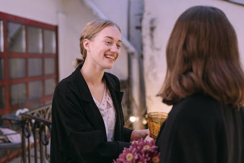 A cheerful evening gathering with friends indoors, capturing warmth and laughter.