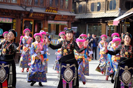 Lively street performance of traditional dance in Diqing Tibetan Prefecture, China, showcasing vibrant cultural attire.