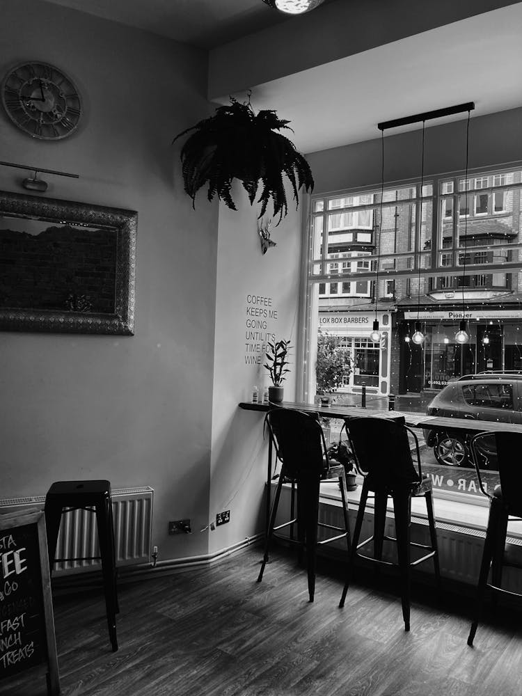 Interior Of Modern Cafe With Counter And Chair Near Big Window