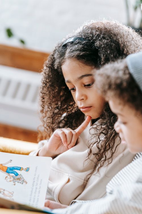 Kids reading a colorful storybook together