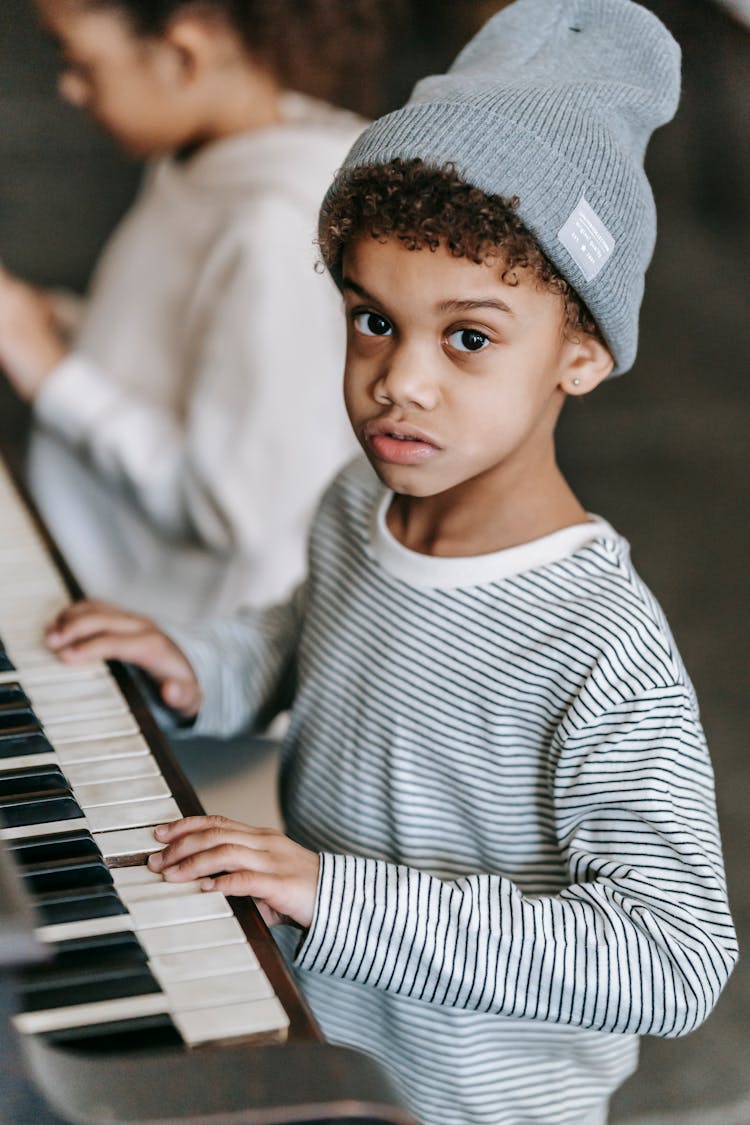 African American Kids Playing Piano At Home