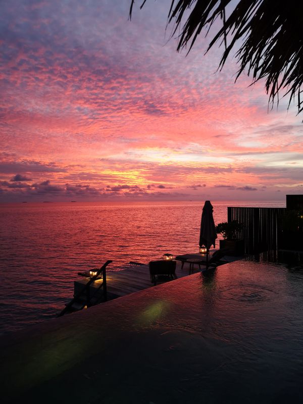 Infinity pool overlooking the sea at sunset