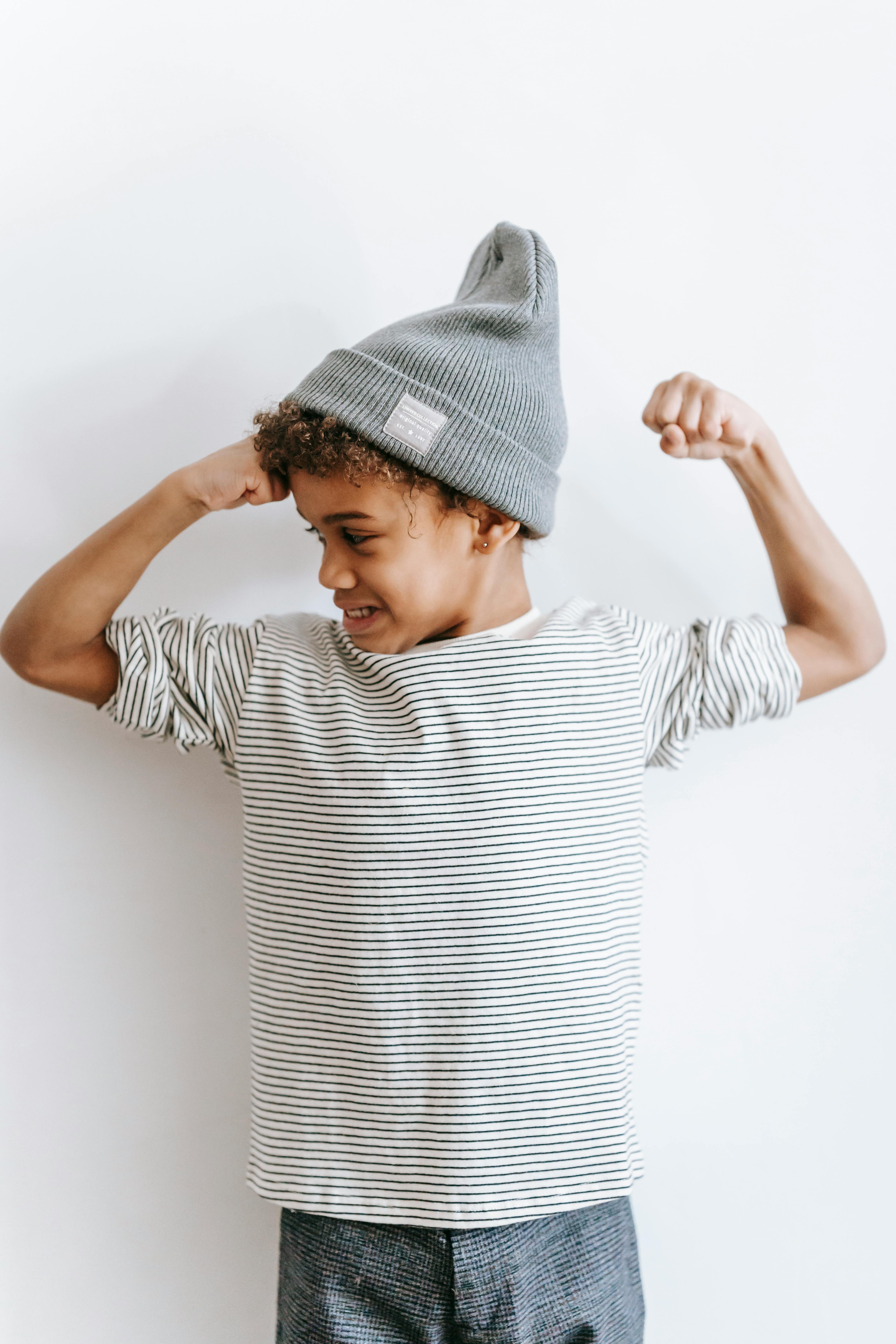 stylish black boy with arms bent in elbows