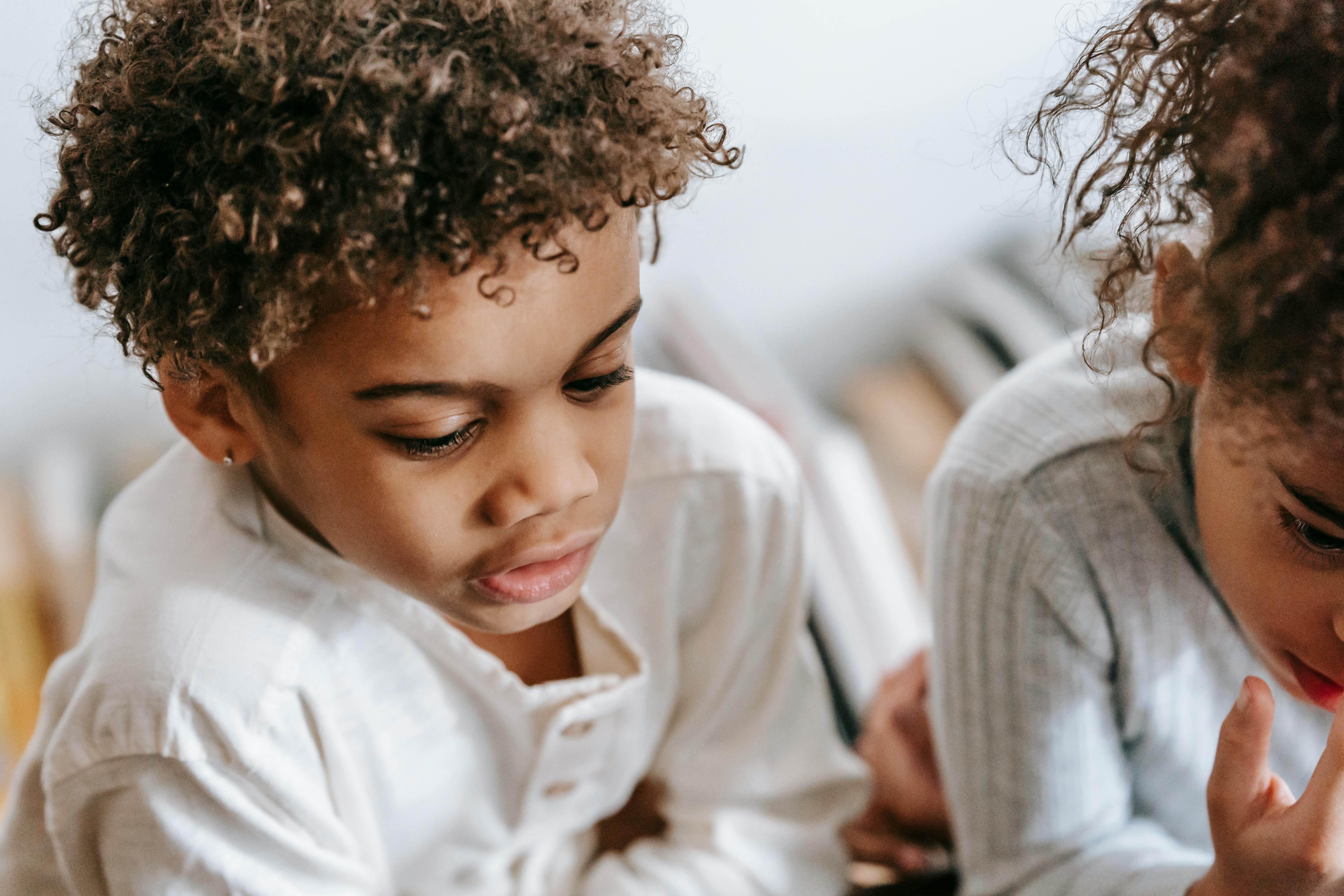 focused black children in flat