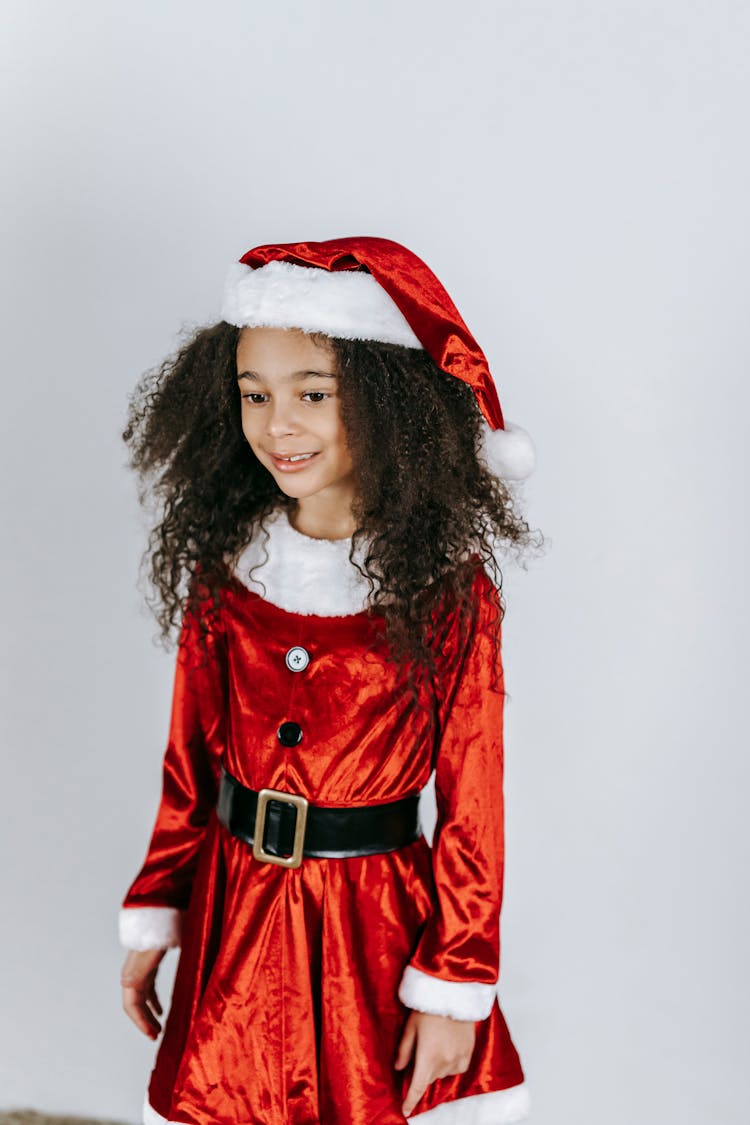 Cheerful Black Girl In Santa Claus Dress