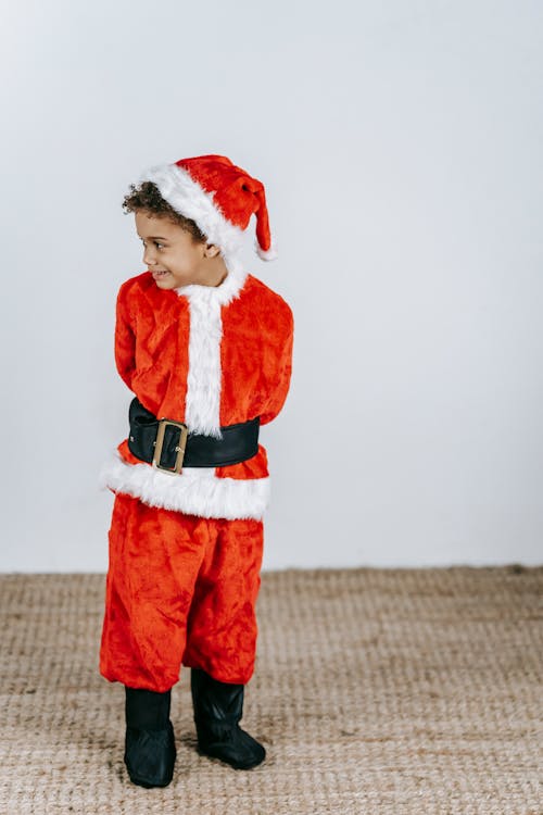 Free Black boy in Santa costume on Christmas day Stock Photo