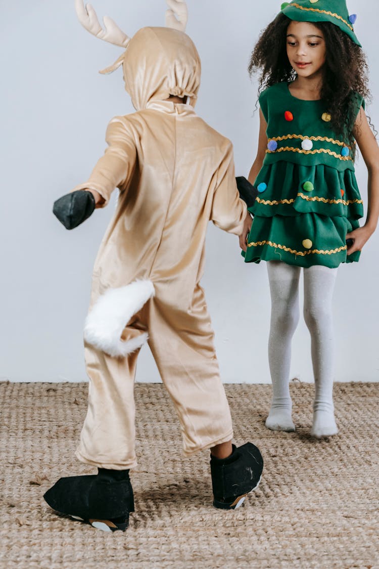 Cute Black Kids In Christmas Costumes Dancing In Studio