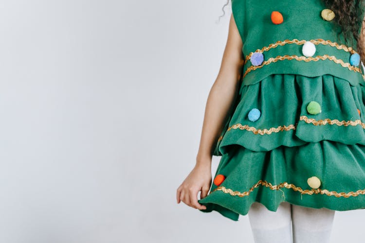 Crop Girl In Christmas Tree Costume