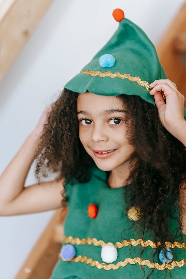 Smiling Black Girl In Christmas Tree Costume With Headwear