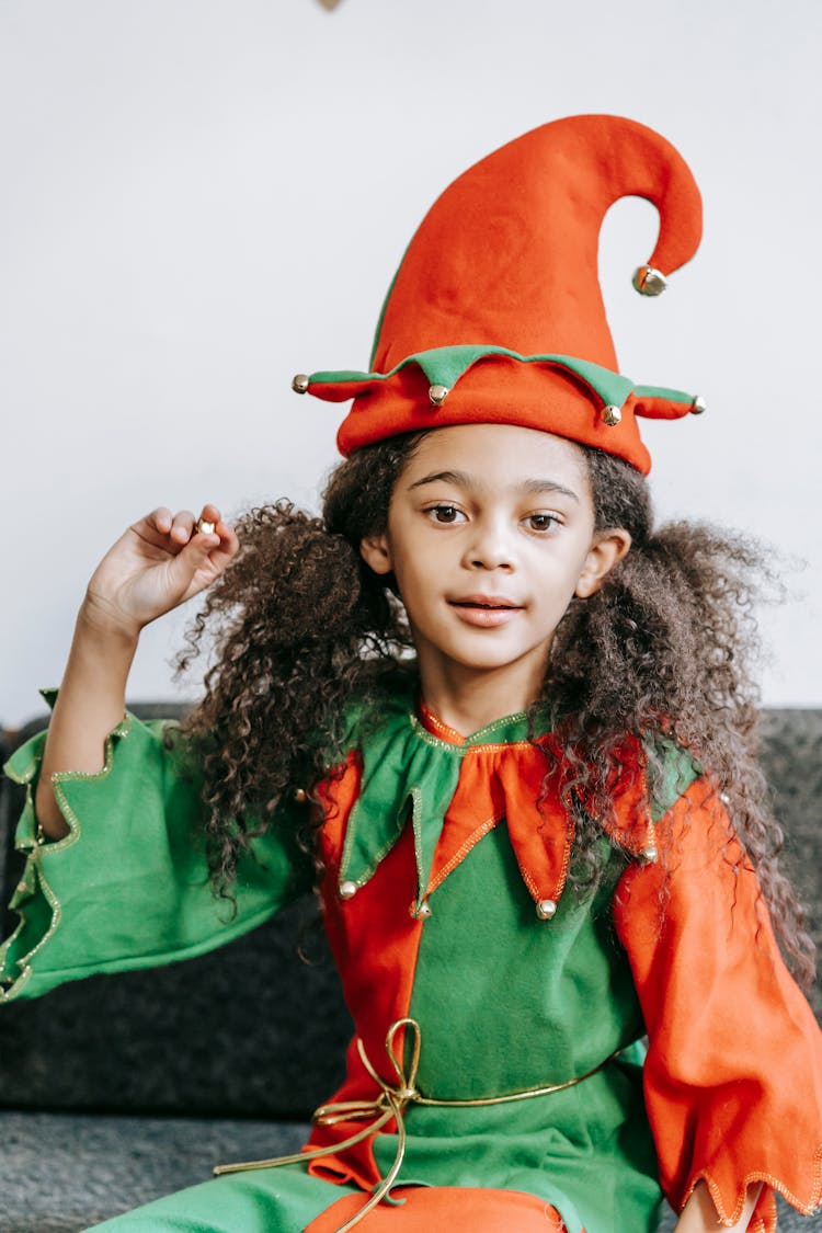 Happy Black Girl In Elf Outfit On Couch