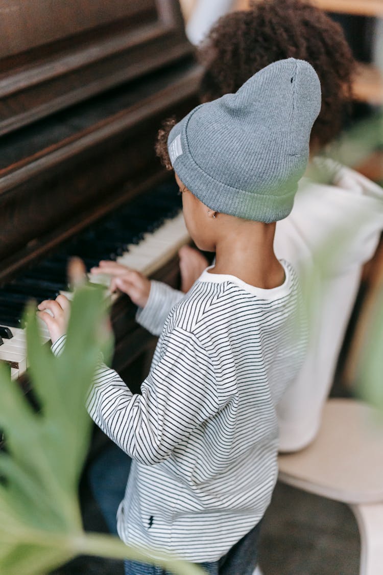 Anonymous Black Kids Playing Piano At Home