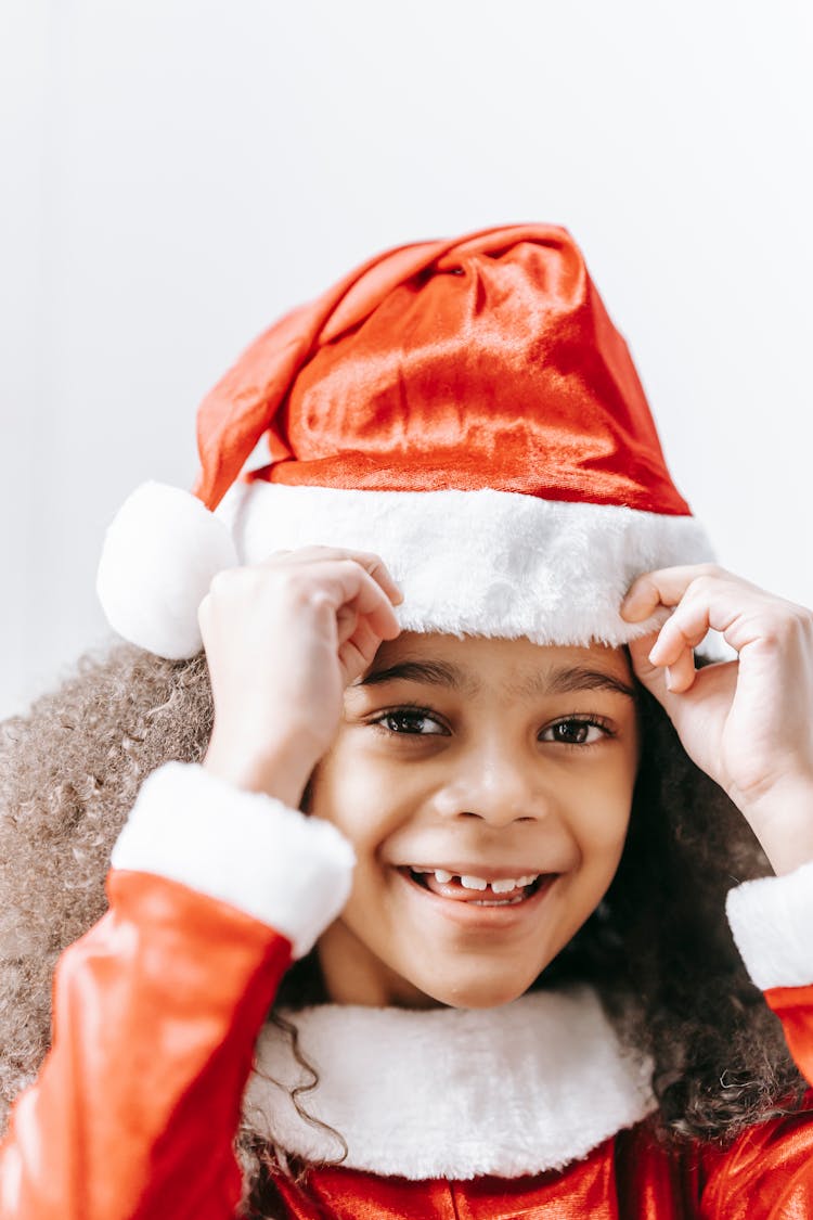 Funny Black Girl Wearing Santa Hat And Smiling