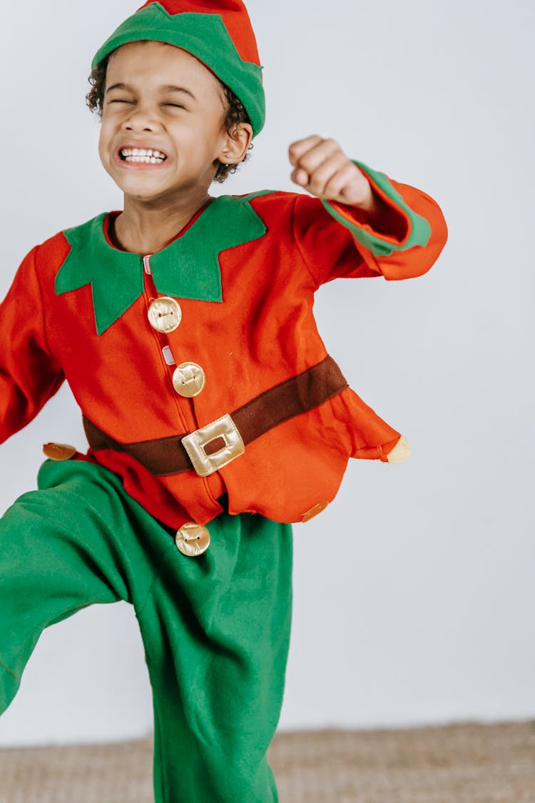 Playful Black Boy In Bright Costume Of Elf