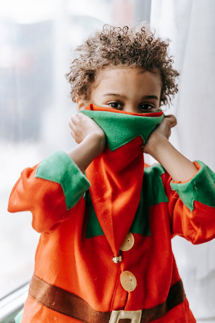 Little Black Boy Hiding In Costume Of Elf