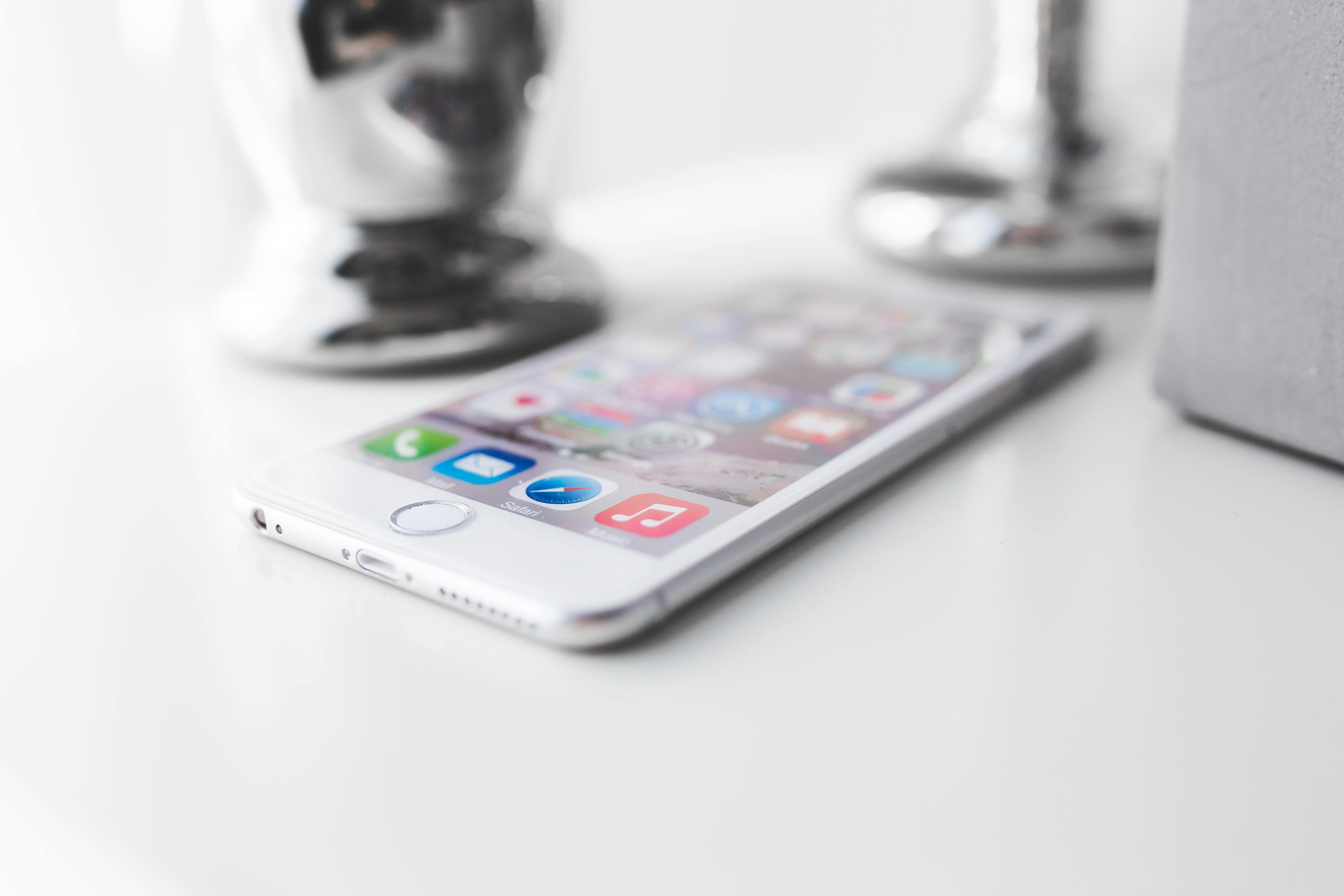 Apple Iphone 6 Plus On A White Desk Free Stock Photo