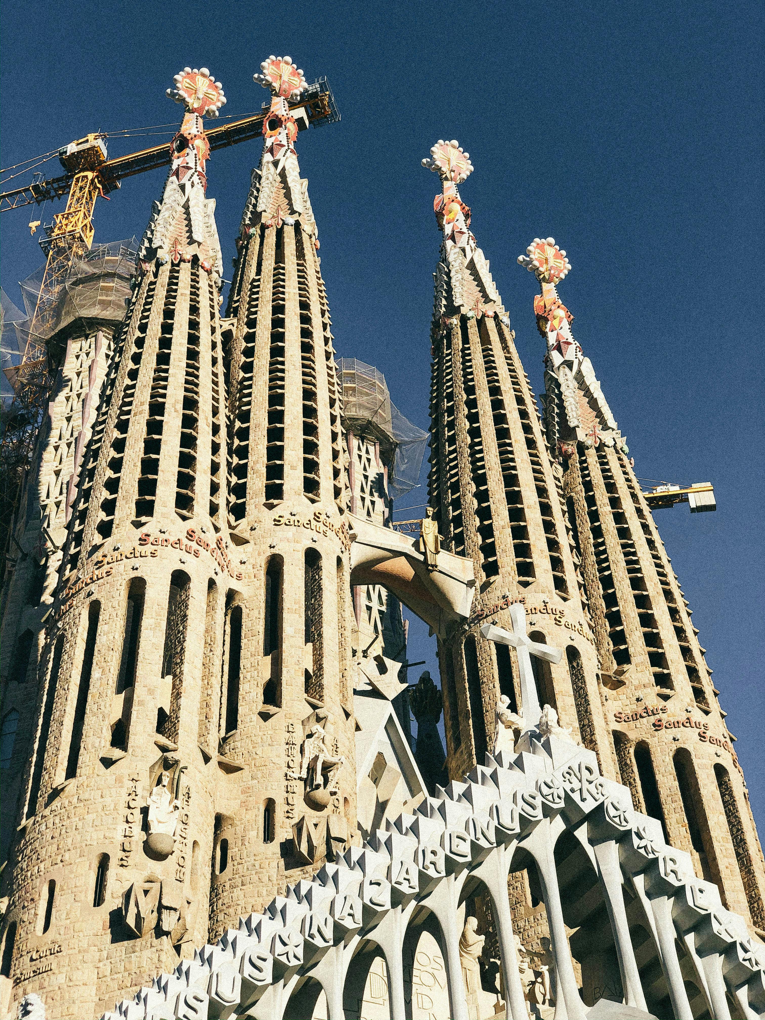 la sagrada familia building under blue sky