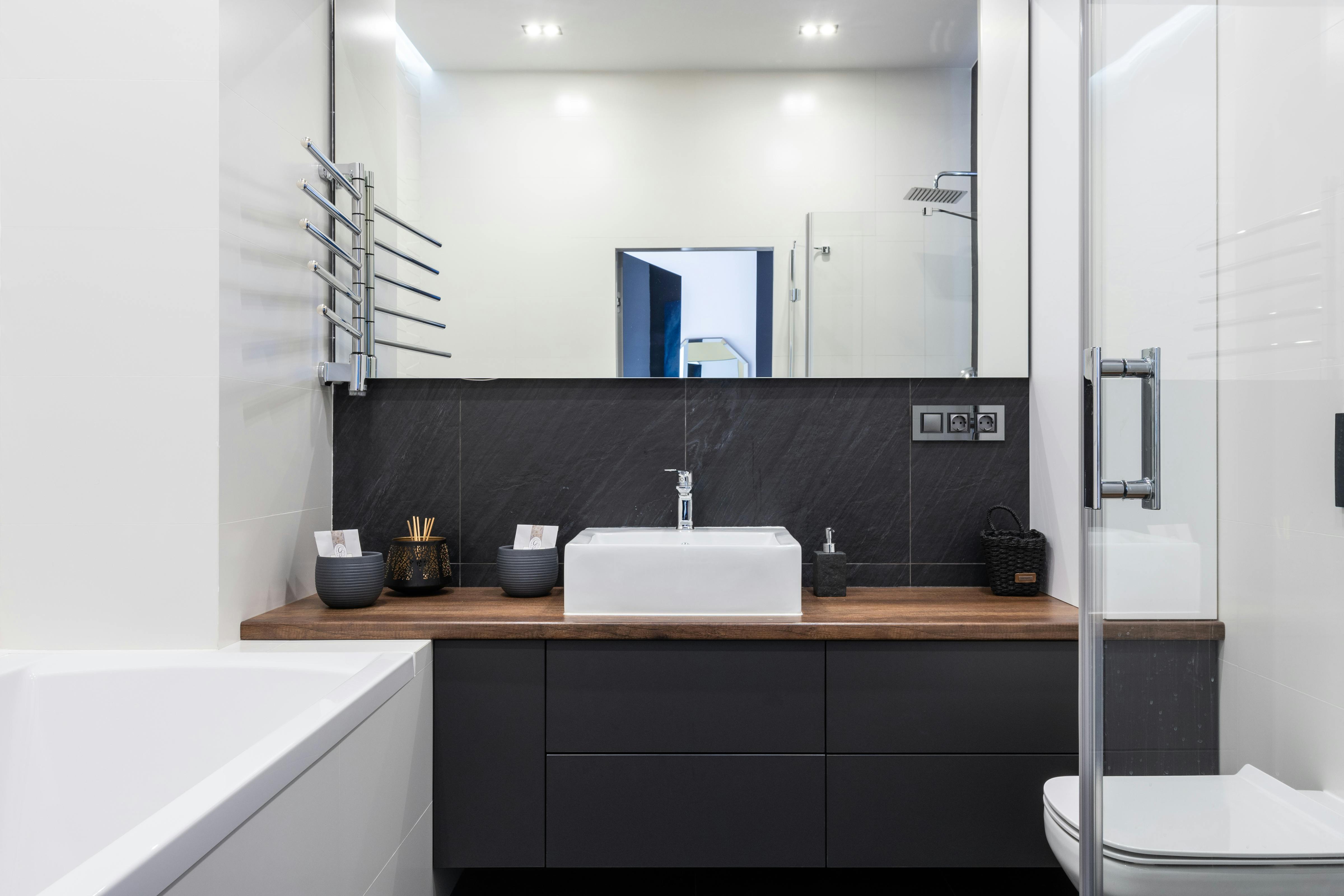 bathroom with shower and bathtub