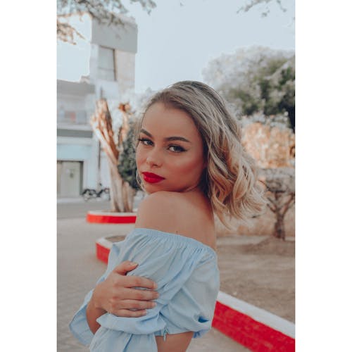 Woman in Blue Off Shoulder Top