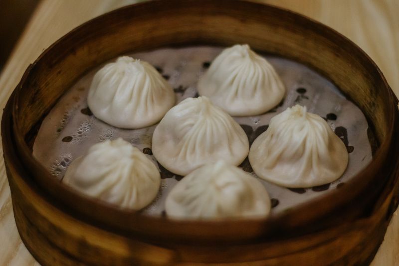 Xiaolongbao soup dumplings in bamboo steamer