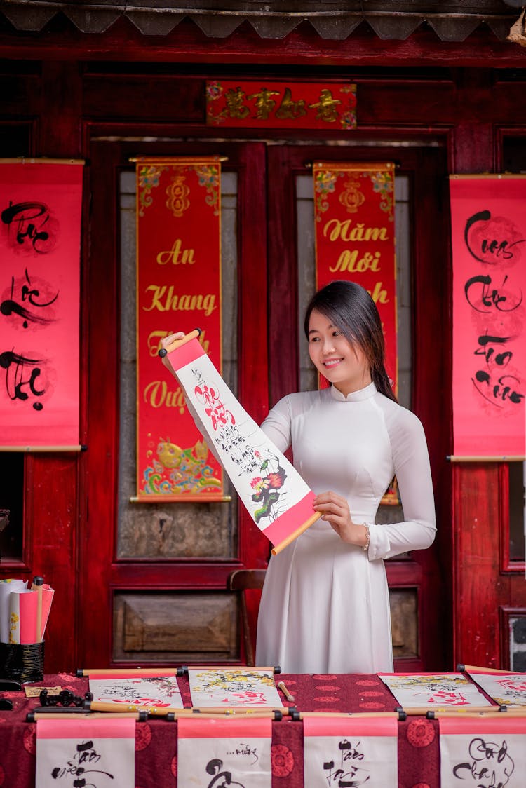 Woman Selling Traditional Asian Scripts