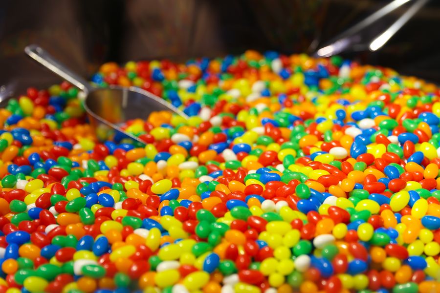 A scoop in a bin of jelly beans