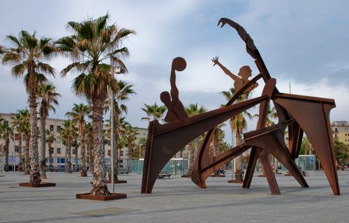 Free Sculpture of basketball players in an open plaza in Barcelona, Spain. Stock Photo