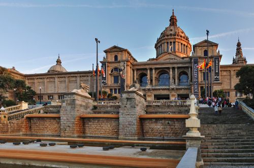 Free View of the National Art Museum of Catalonia at sunset, showcasing its grand architecture in Barcelona, Spain. Stock Photo