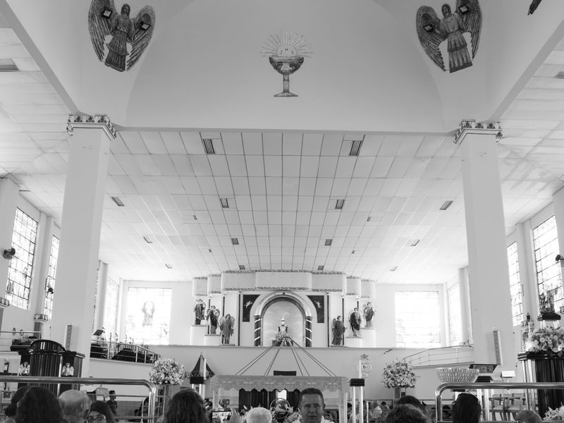 Group of people engaging inside a beautifully designed religious space with artwork - congregation history tours
