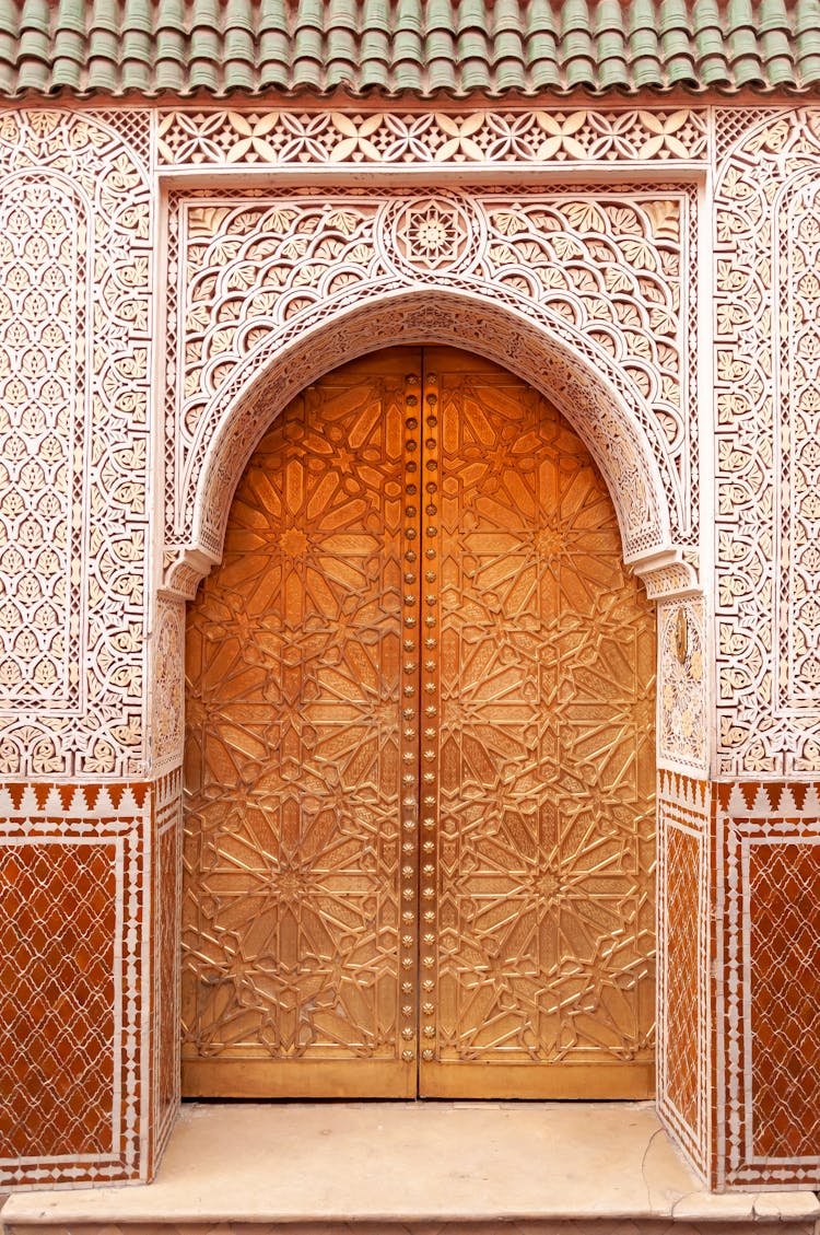 Ornamental Walls And Arched Wooden Door Of Arabic Palace