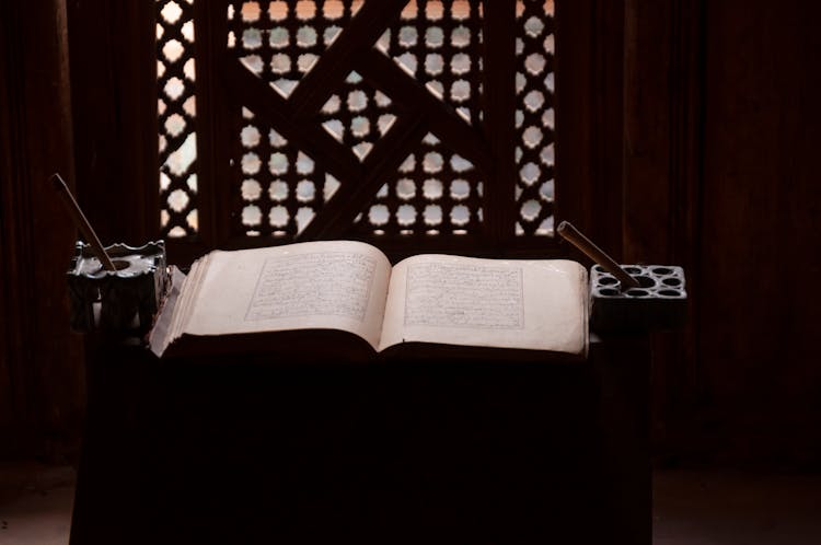 Opened Koran Placed On Table In Traditional Islamic College