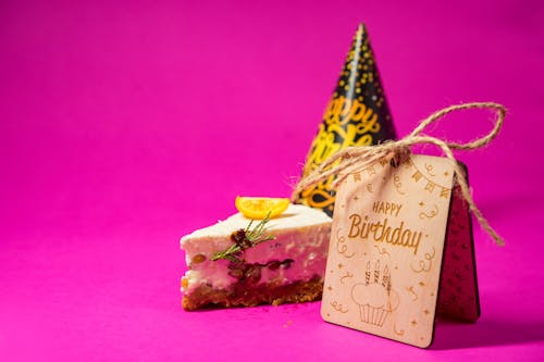 Free A Slice of Birthday Cake on Pink Surface Stock Photo