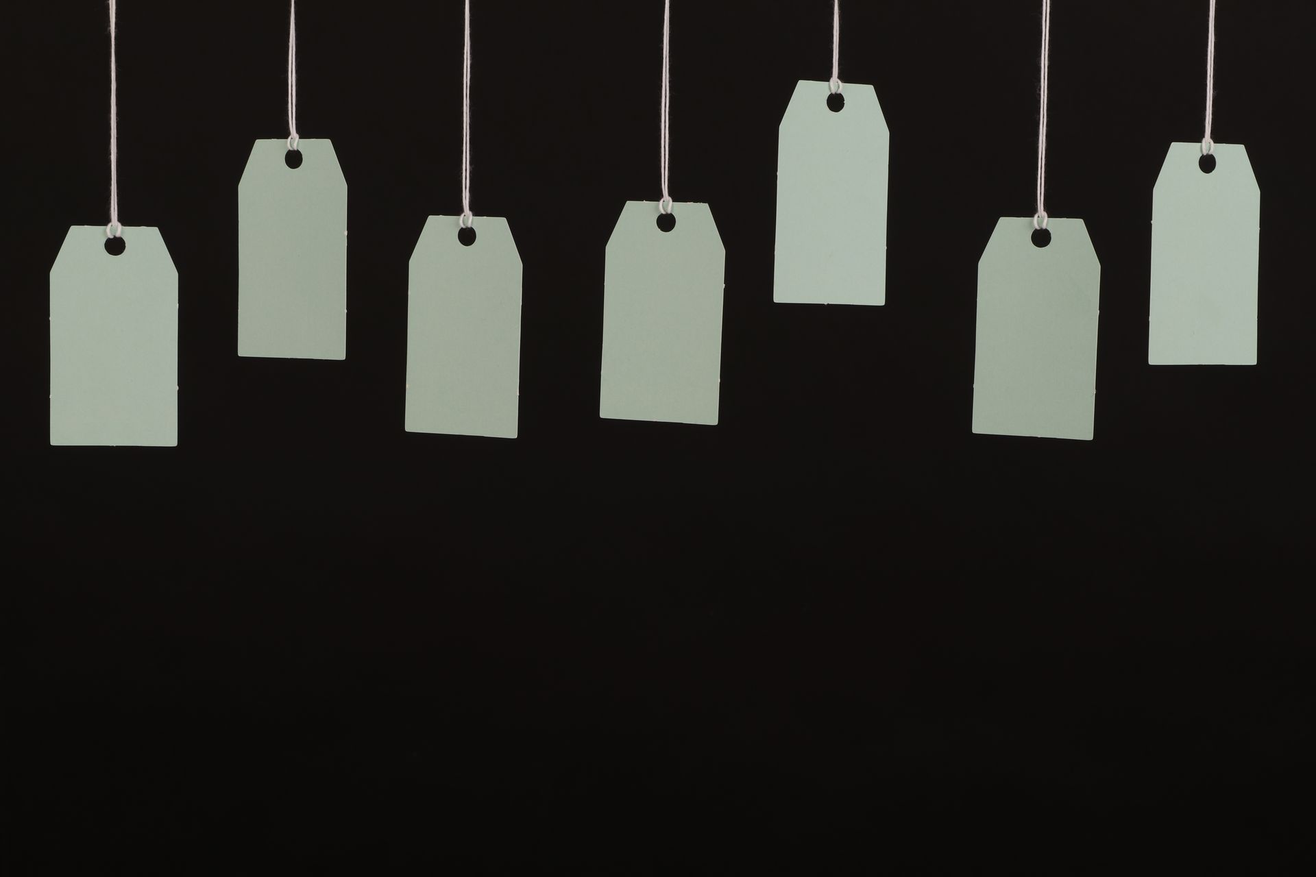 Blank hang tags hanging on strings