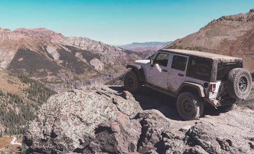 Free An Off Road Vehicle on a Natural Rock Formation Stock Photo