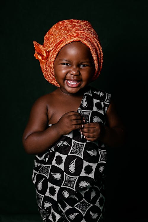 Smiling Little Girl Wearing a Headwrap