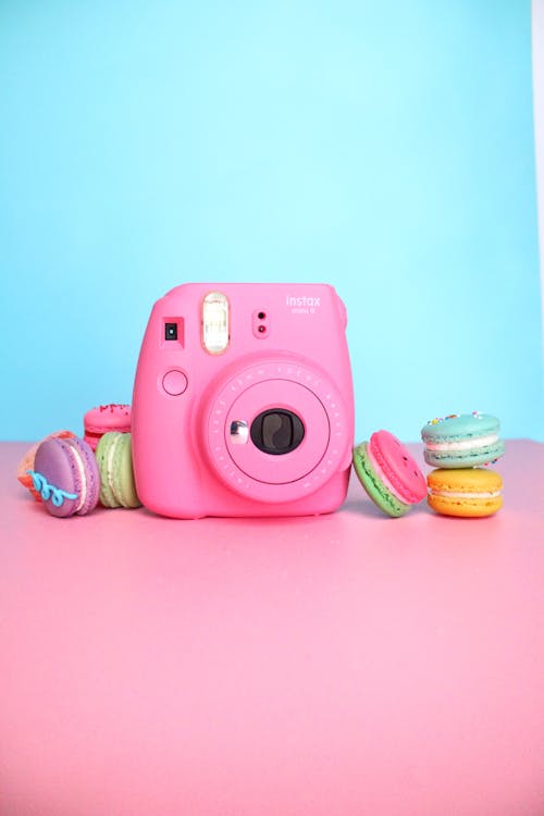 Free Instax Camera and Sweet Macarons Stock Photo