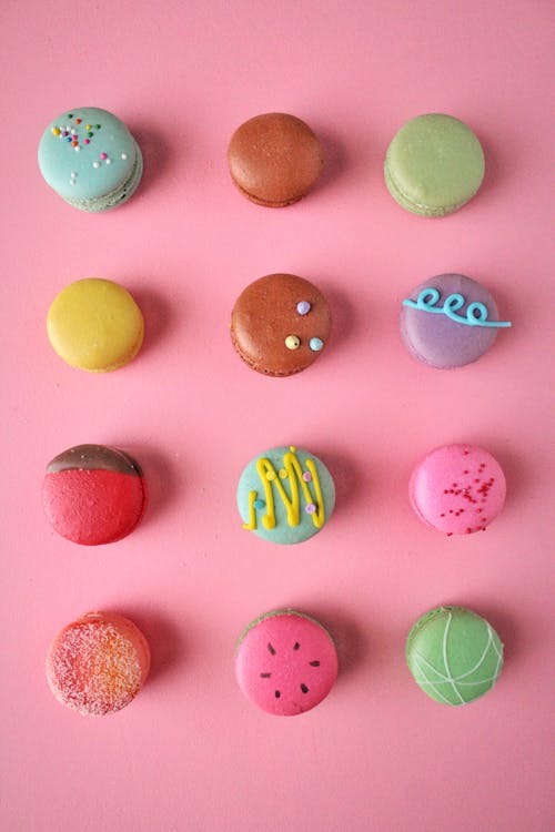 Colorful Macarons on Pink Surface