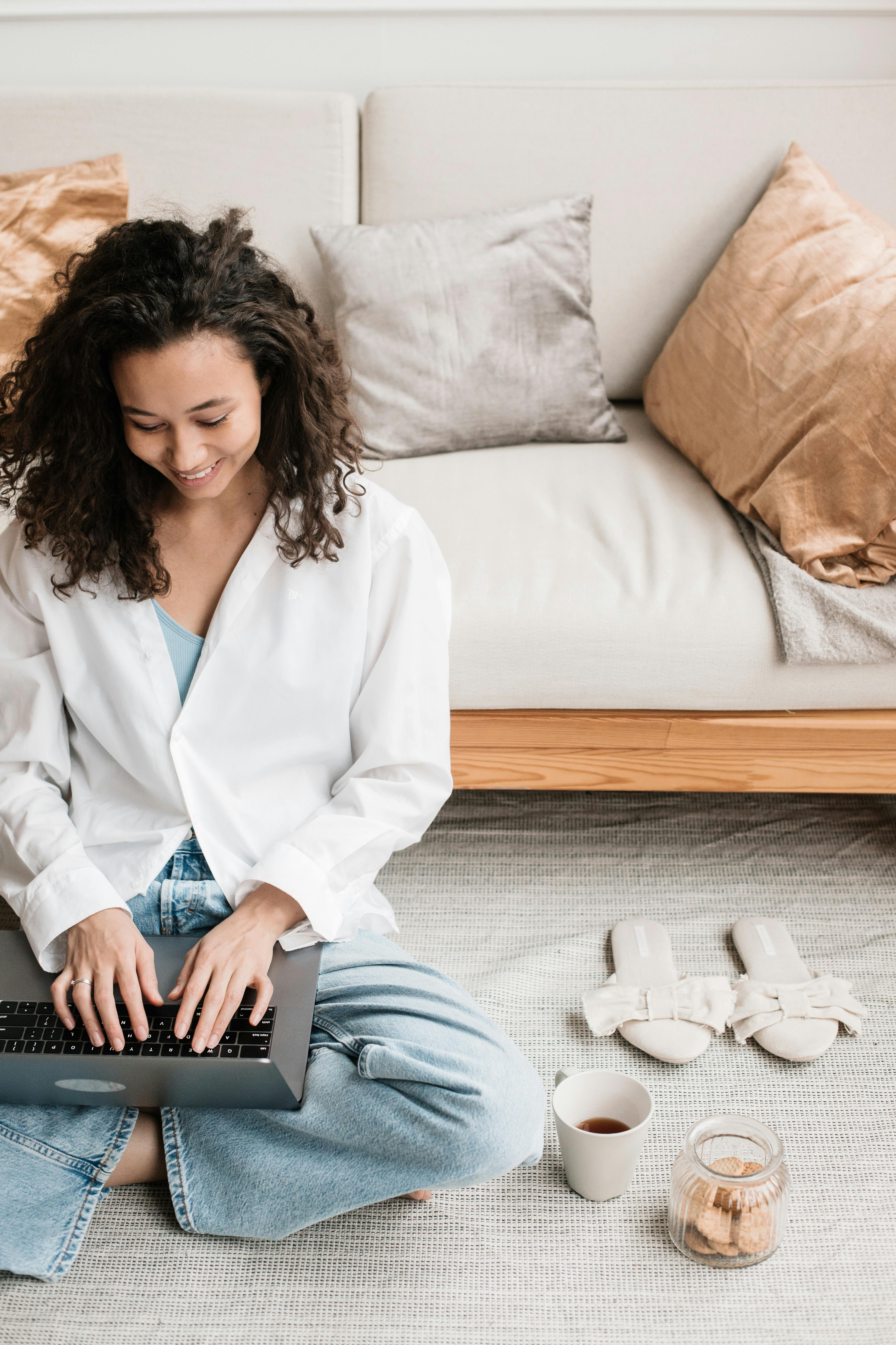 woman typing on laptop keyboard