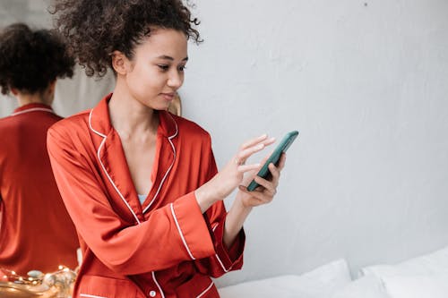 Free Woman Holding her Phone Stock Photo