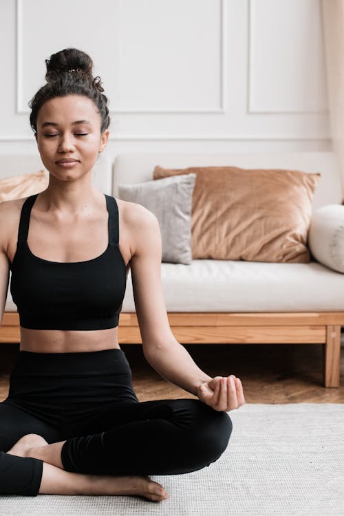 Free Woman in Black Activewear Doing Yoga Position Stock Photo