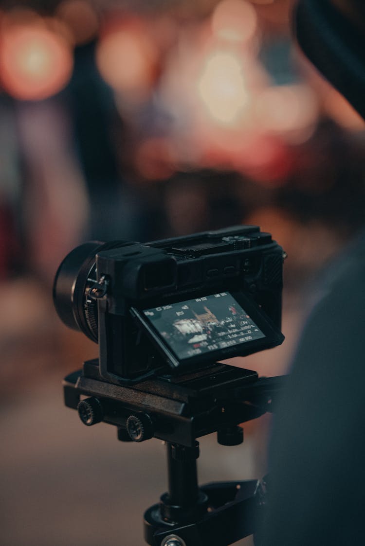 Crop Person Filming Video On Professional Camera