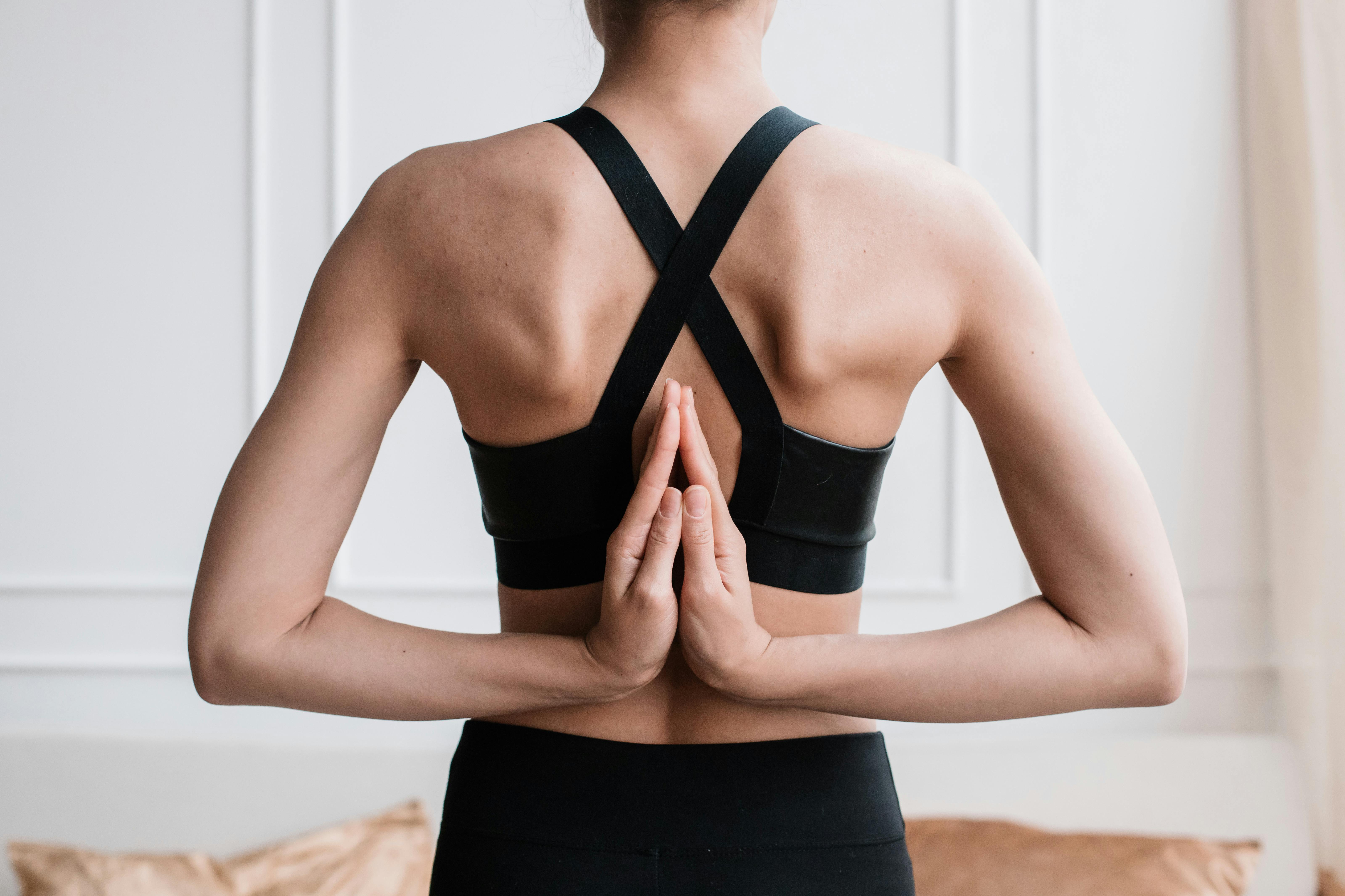 Women practicing yoga: reverse prayer pose - Stock Image - Everypixel